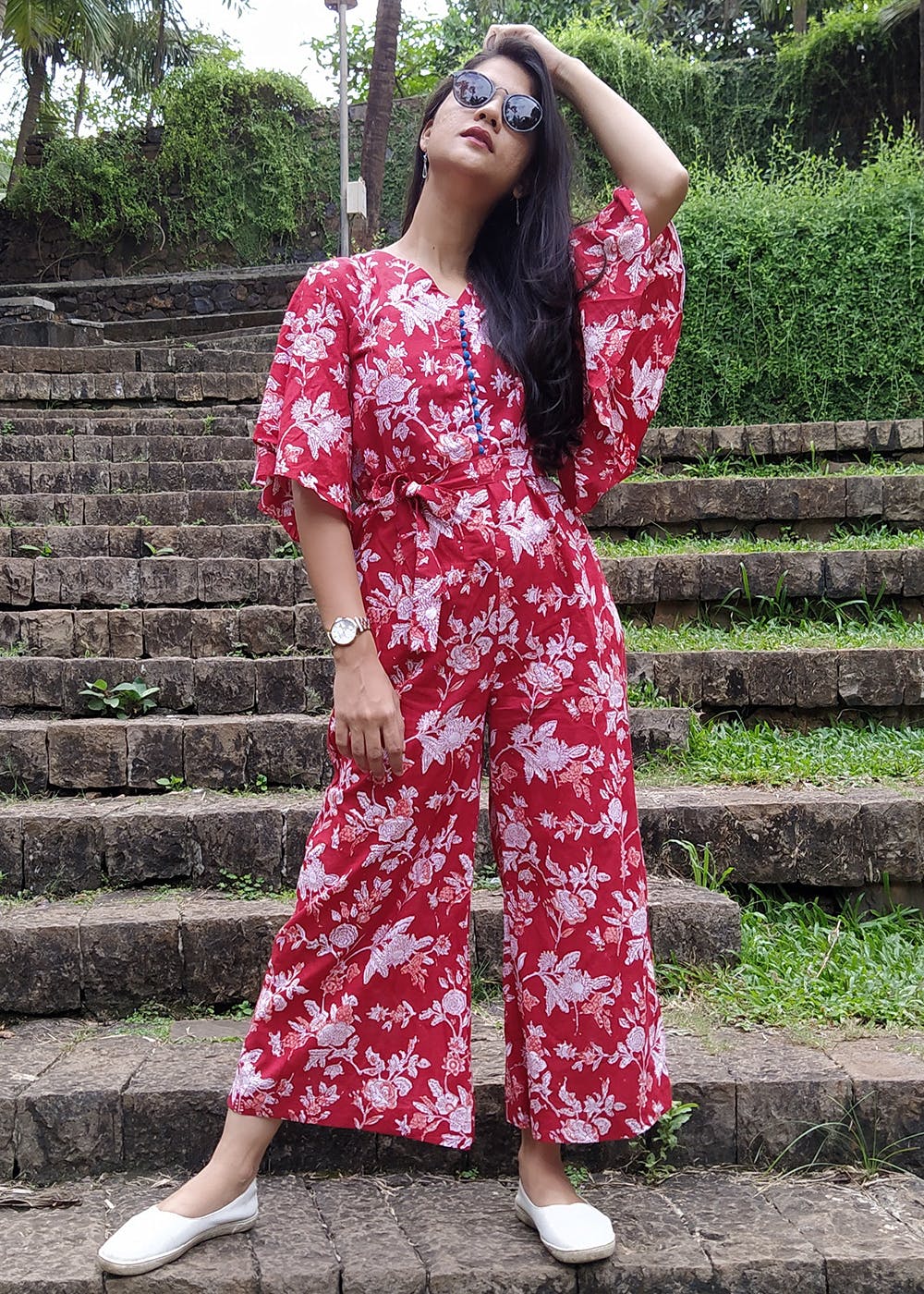 red jumpsuit with bell sleeves